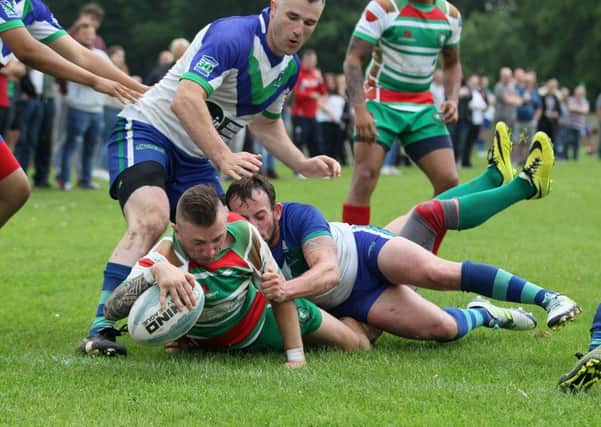 Peter Alldread powers through to score a try for Wolfhunt  - Pic by: Richard Parkes