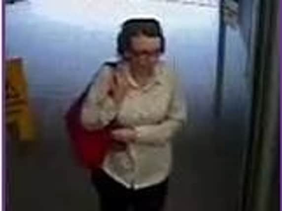 Police image: Officers would like to speak to this woman in connection with a card theft.