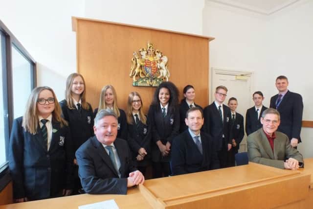 from left: Leah Cornish, Emily Hubbard, Molly Hall, Mya Brady, Hollie Whittle, Rebecca Norris, Tom Williams, Benjamin Rice and Dylan Hopkins, teacher Gavin Brookes
Front row from left: Councillor Glynn Gilfoyle, Community Safety Chairman, at Nottinghamshire County Council, Tim Desmond, CEO Galleries of Justice Museum, Paul Bowden, Chairman of Trustees, National Centre for Citizenship and the Law.