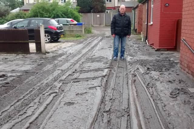 Victor Jennings on Elkesley Place the day after it was submerged in a river of slurry.