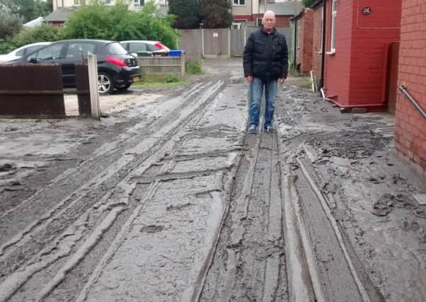 Victor Jennings on Elkesley Place the day after it was submerged in a river of slurry.