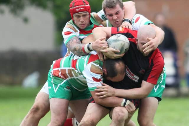 The Wolfhunt defence halt a Buxton surge forward  - Pic by: Richard Parkes
