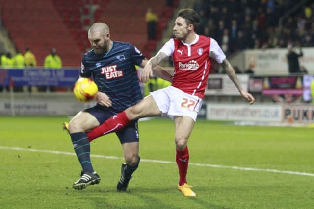 Rotherham's Matt Derbyshire tangles with Derby's Jake Buxton-Pic by: Richard Parkes
