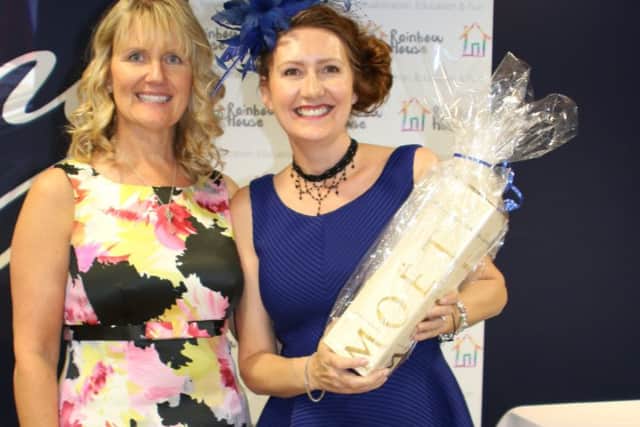 BIG NIGHT OUT Suzy Orr, operations director of Windoworld, with Jane Rapin, who won best dressed at Rainbow House Royal Ascot Ladies Day