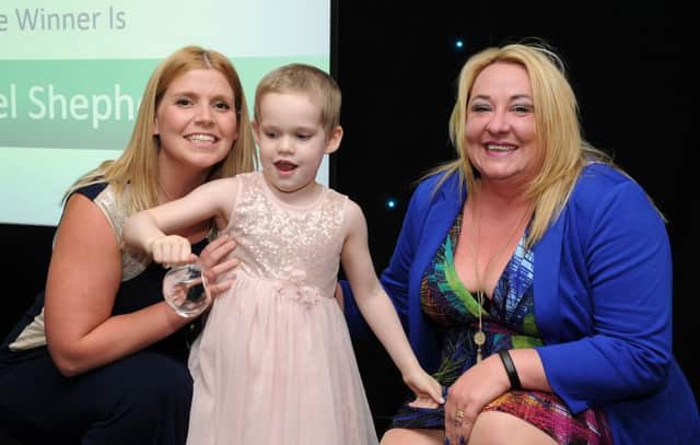 Rachel Shepherd with Ella are presented with the winnres award for Best Teaching Assistant by Jo Warburton at the Chad Best in Schools 2016 awards. Picture: Andrew Roe