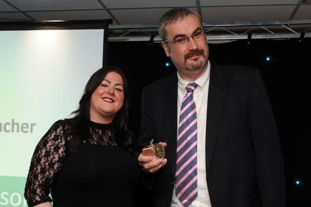 Simon Hutchinson is presented with his winners award for Best Secondary Teacher by Hayley Mason at the Chad Best in Schools 2016 awards. Picture: Andrew Roe