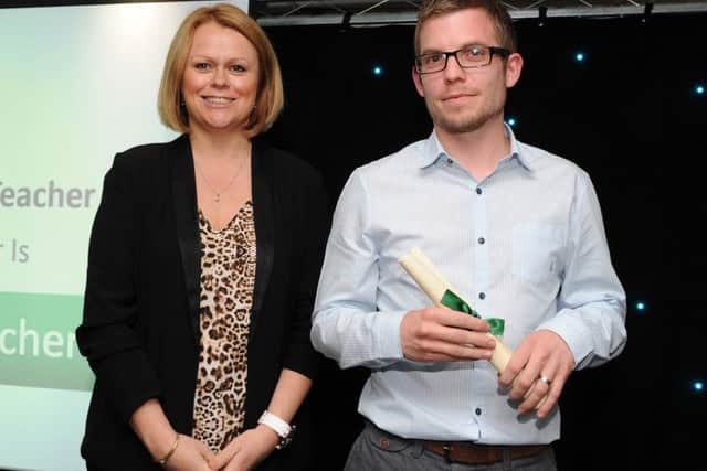Craig Ashton is presented with the special recognition award for Best Primary Teacher by Imogen Hoyle at the Chad Best in Schools 2016 awards. Picture: Andrew Roe