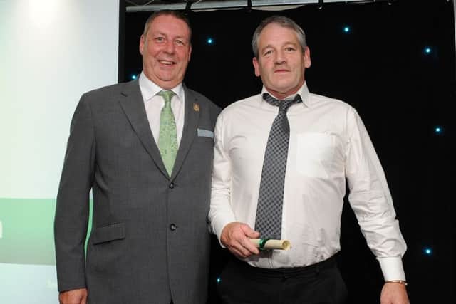 David Hewitt is presented with the special recognition award for Best Volunteer by Mick Shaw at the Chad Best in Schools 2016 awards. Picture: Andrew Roe