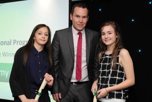Alexis Smith-Woodhouse and Chloe Wint are presented with the special recognition award for Educational Progress by Ryan Hawley at the Chad Best in Schools 2016 awards. Picture: Andrew Roe