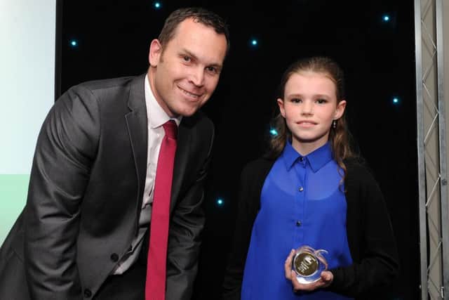 Amy Sim is presented with the winners award for Educational Progress by Ryan Hawley at the Chad Best in Schools 2016 awards. Picture: Andrew Roe