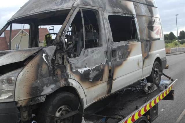 This is the scene of destruction after a van caught fire.