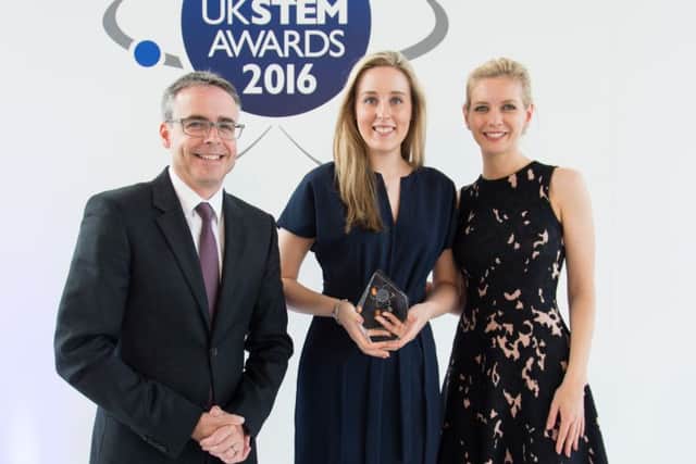 Abi Wetton receives her innovation award from McLaren's Peter Bermingham and Rachel Riley