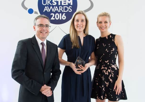 Abi Wetton receives her innovation award from McLaren's Peter Bermingham and Rachel Riley