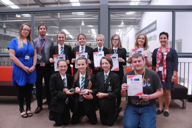 Construction tutor Lynsey Hanson with art teacher Nick Freer, pupils and students with Valeria Carnevale - far right