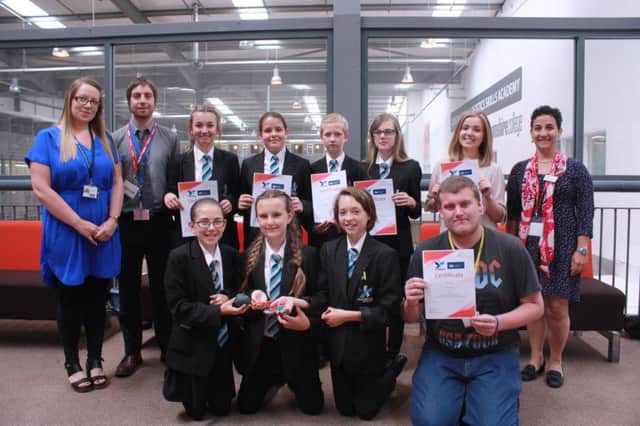 Construction tutor Lynsey Hanson with art teacher Nick Freer, pupils and students with Valeria Carnevale - far right