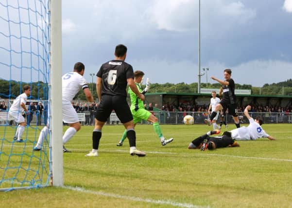 Mansfield Town's James Baxendale opens the scoring  - Pic Chris Holloway