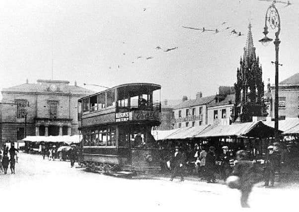 A tram in Mansfield's Market Place - the town's tram service was officially inaugurated 111 years ago today.