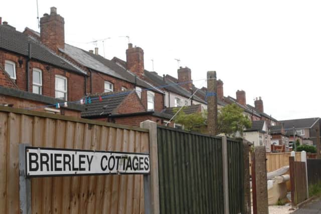 A street in Sutton was the scene of a dramatic police operation last night after officers swooped on an address with reports of a man branding a handgun.