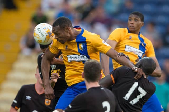 Mansfield Town vs Hull City - Krystian Pearce goes up for a header - Pic By James Williamson