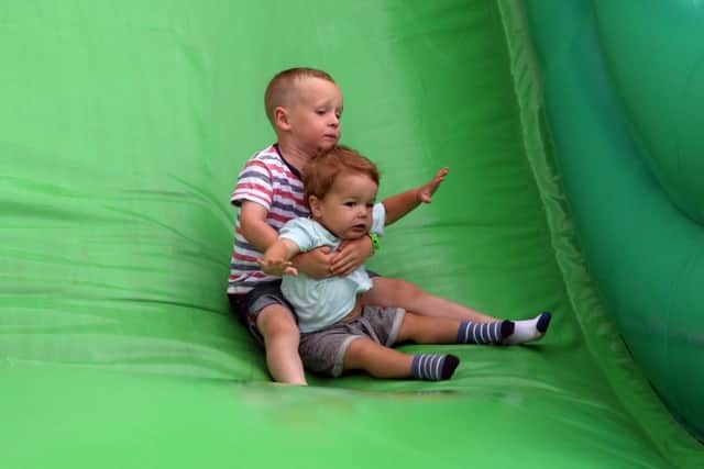 Alfie Carr and Noah Fownes went for a ride on the giant slide.