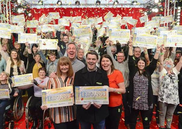 Pictured at Witton Park Blackburn are Peoples Postcode Lottery winners.  All pictures cleared for release.  Pictures Copyright Darren Casey / DCimaging 07989 984643   Strictly no syndication without prior agreement.