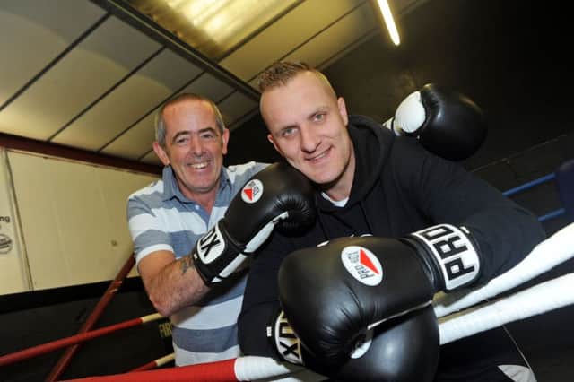 Boxing trainer, Paul Hillman, right, with John Loughrey at the Elite Fight Academy, where Paul is going 100 rounds against all comers, for Macmillan Cancer Care.