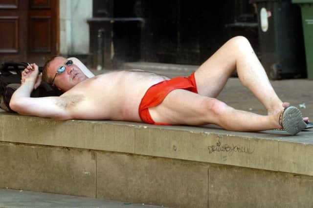 Grant Holland 'caused offence' by sun bathing outside Sheffield City Hall in 2006.