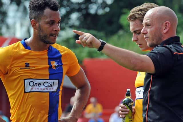 Alfreton Town v Mansfield Town.Adam Murray gives instruction to Matt Green during a water break in the first half.