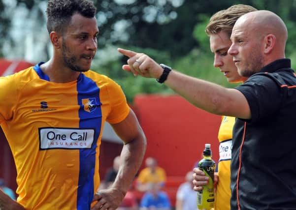 Alfreton Town v Mansfield Town.
Adam Murray gives instruction to Matt Green during a water break in the first half.