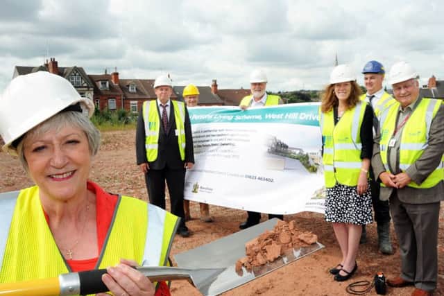 Mansfield's Mayor, Coun. Kate Allsop, cuts the ceremonial sod for the new senior persons living scheme on West Hill Drive on Tuesday, with Co. Coun. Alan Bell, the vice-chairman of Adult Social Care Health at Notts County Council, Rob Purser strategic housing manager at Mansfield District Council, Coun. Joyce Bosnjak deputy leader of NCC, Coun. Dave Saunders, regeneration portfolio holder MDC, Coun. Barry Answer, housing portfolio holder MDC and Graham Wates project manager of Wates, the builders.