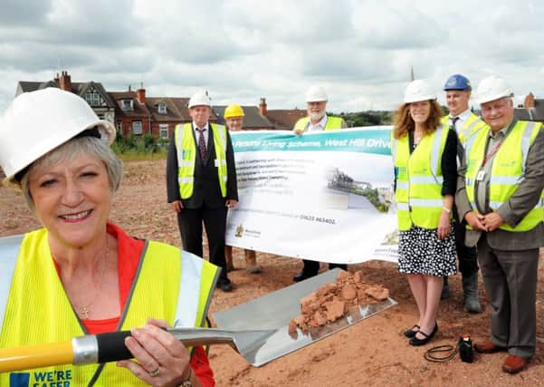 Mansfield's Mayor, Coun. Kate Allsop,  cuts the ceremonial sod for the new senior persons living scheme on West Hill Drive on Tuesday, with Co. Coun. Alan Bell, the vice-chairman of Adult Social Care Health at Notts County Council,  Rob Purser strategic housing manager at Mansfield District Council, Coun. Joyce Bosnjak deputy leader of NCC, Coun. Dave Saunders, regeneration portfolio holder MDC, Coun. Barry Answer, housing portfolio holder MDC and Graham Wates project manager of Wates, the builders.