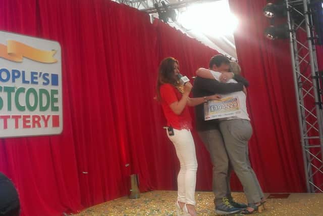 Mansfield couple Chris and Shona Vasper hug each other after winning Â£194,229 in the People's Postcode Lottery.