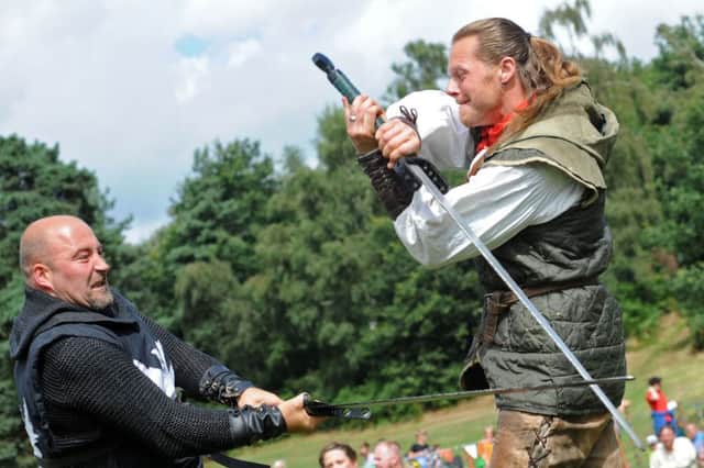 Robin Hood, (Steve Warrington), sets to with one of the Sheriff's men.