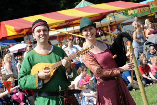 The entertainers enter the arena at the 32nd annual Forbin Hood Festival which opened on Monday.