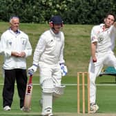 LUNG-BUSTER -- bowler Tom Lungley puts everything into his bowling for Welbeck in a local derby against Mansfield Hosiery Mills.