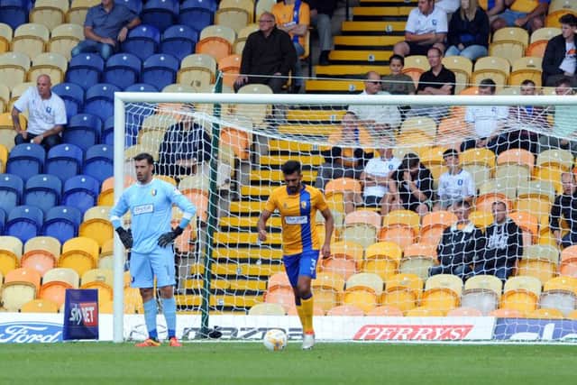 Mansfield Town v Cheltenham'Keeper, Scott Shearer and Mal Benning ponder the wonder strike that levelled things up a the One Call Stadium on Saturday.