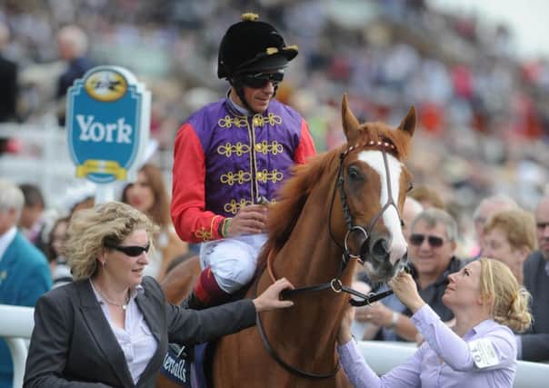 RACING ROYALTY -- Frankie Dettori rides a winner for The Queen this time last year at the Ebor Festival at York.