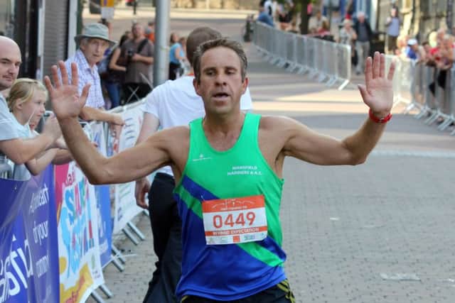 Mark Johnson crosses the winning line last year.