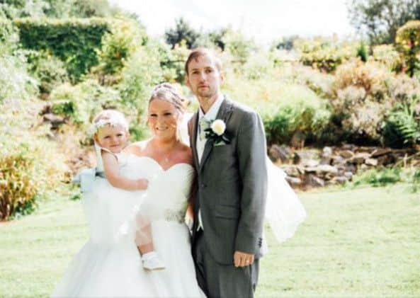 The new Mr and Mrs Landau with their baby daughter, Lucy.