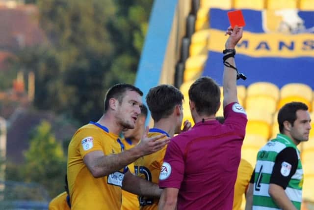 Mansfield Town v Yeovil Town.
Captain, Lee Collins, interceeds for Danny Rose in vain as he is sent off early in the first half.