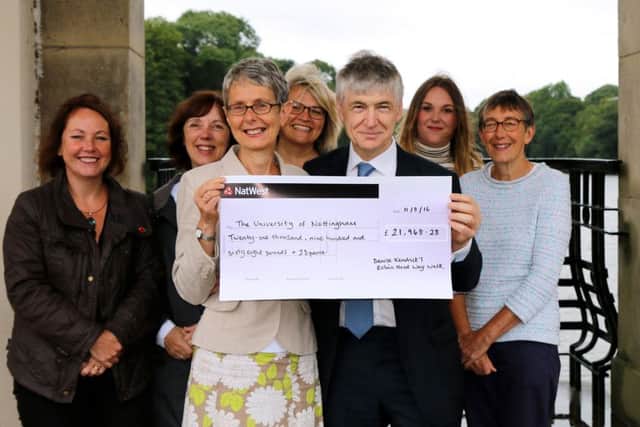 Denise Kendrick presents cheque to John Roberston with Robin Hood Way walkers