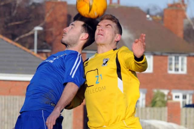 ON TARGET -- Lewis Bingham (left) scored one of Ollerton Town's goals.