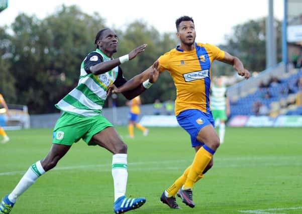 Mansfield Town v Yeovil Town.    
Matt Green and Yeovil's Nathan Smith