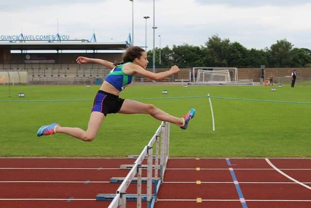 FREE-FLOWING LAKE -- Mansfield Harrier Jess Lake shows the sprint hurdling style that helped her to fourth place in the Leicestershire and Rutland Pentathlon at the weekend.