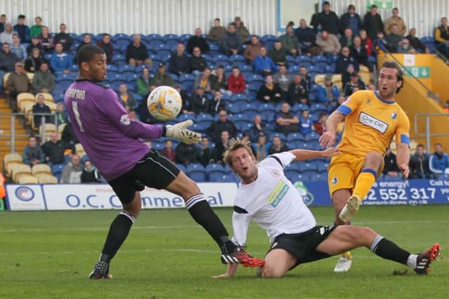 Ollie Palmer is foiled by Accrington defender Rob Atkinson -Pic by: Richard Parkes