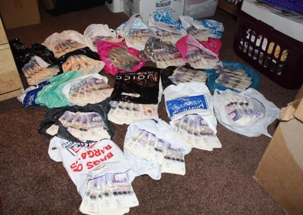 HMRC officers raided their property in December 2014 and seized Â£97,765 in cash, which was found in carrier bags.