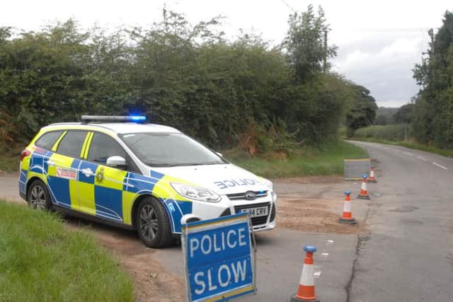 Police block the entrance to Cross Lane, Blodworth, after a fire at a sawmill plant.