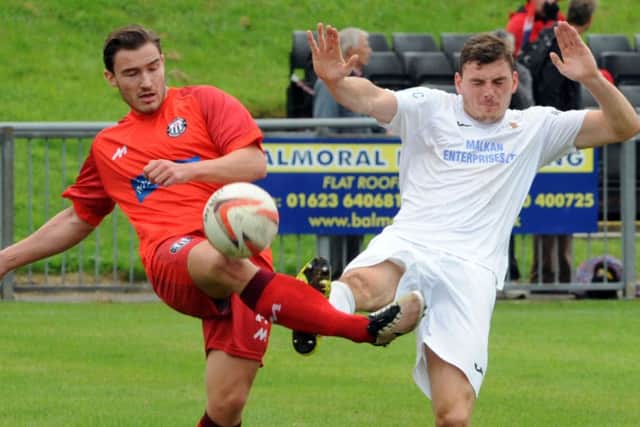 Action from Rainworth Miners Welfare (in white) against Heanor Town on Saturday in the FA Vase, Heanor running out 4-1 winners. All photos by Anne Shelley.
