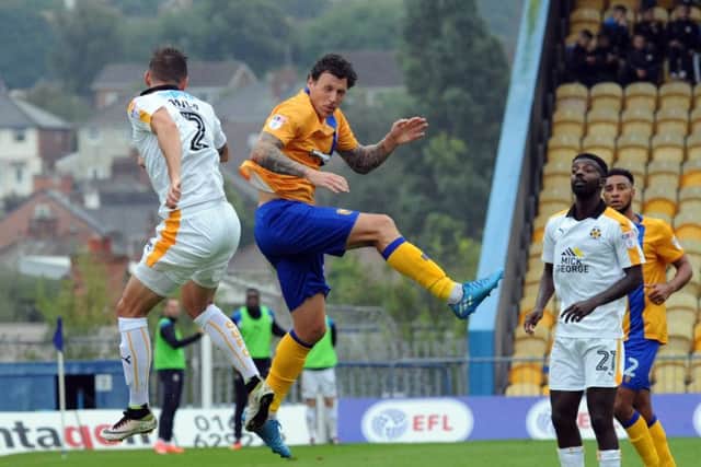 Mansfield Town v Cambridge
Darius Henderson in aerial competition with Greg Taylor.