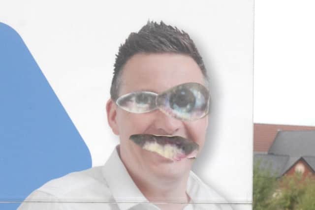 The image looks like a a pair of Groucho glasses, and is believed to have been designed and meticulously cut out by the vandal.